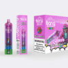 Packaging and product display of "Bang Mixed Berries" disposable vape, featuring a purple vape pen with colourful graphics, berry illustrations, and a skeleton mascot, along with a health warning label.