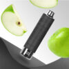 A black vape device surrounded by slices of green apple and a whole green apple, set against a gradient background with a textured black surface.