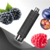 A black vape device with a digital display is surrounded by various fruits, including blackberries, blueberries, raspberries, and a cut-open fruit revealing seeds, set against a gradient background and a textured leather surface.