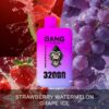 A vape device packaging featuring a purple and white design with a gorilla logo, labeled "BANG LEADER" and "STRAWBERRY WATERMELON GRAPE ICE" alongside "32000 PUFFS." The background includes splashes of red watermelon, strawberries, and grapes.