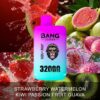 A vibrant vape product called "Bang Leader," featuring a colorful design with a monkey wearing sunglasses, positioned against a background of splashing fruits like strawberries, watermelon, kiwi, and guava. Text on the product highlights "Strawberry Watermelon Kiwi Passion Fruit Guava" and mentions "3200 PUFFS."