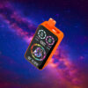 A vibrant orange electronic device displaying colorful graphics and battery indicators on its screen, set against a deep, starry outer space background.