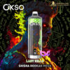 A cosmetic or vape product bottle labeled 'OKSO' with a futuristic, fiery design featuring a glowing red-eyed, horned demon face in the background surrounded by mystic symbols and colorful flames in green, red, and blue hues, with the text 'LADY KILLA' and 'SHISHA HOOKAH MEGA' below.