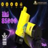 Two yellow Bang King vape devices with cartoon monkey and strawberry illustrations, highlighting features like 3-in-1 adjustable flavors, 85,000 puffs, 600mAh battery, and type-C charging on a dark, glowing abstract background