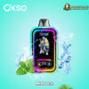 OKSO branded vaping device with a colorful neon frame and a graphic of a skeleton wearing a jacket and sneakers on the screen, surrounded by splashing water, ice cubes, and fresh mint leaves on a turquoise background, with logos for OKSO and DOGEVAPE and the text MINT ICE