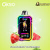 Colorful OKSO vape device with neon-lit screen featuring a person in a yellow jacket, accompanied by images of a fresh strawberry and watermelon slices on a light green background with logos for OKSO and Dogevape.